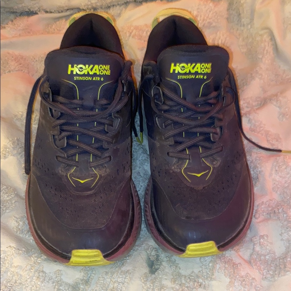 Hoka One One Stinson ATR 6 Grey and Pink sneakers.